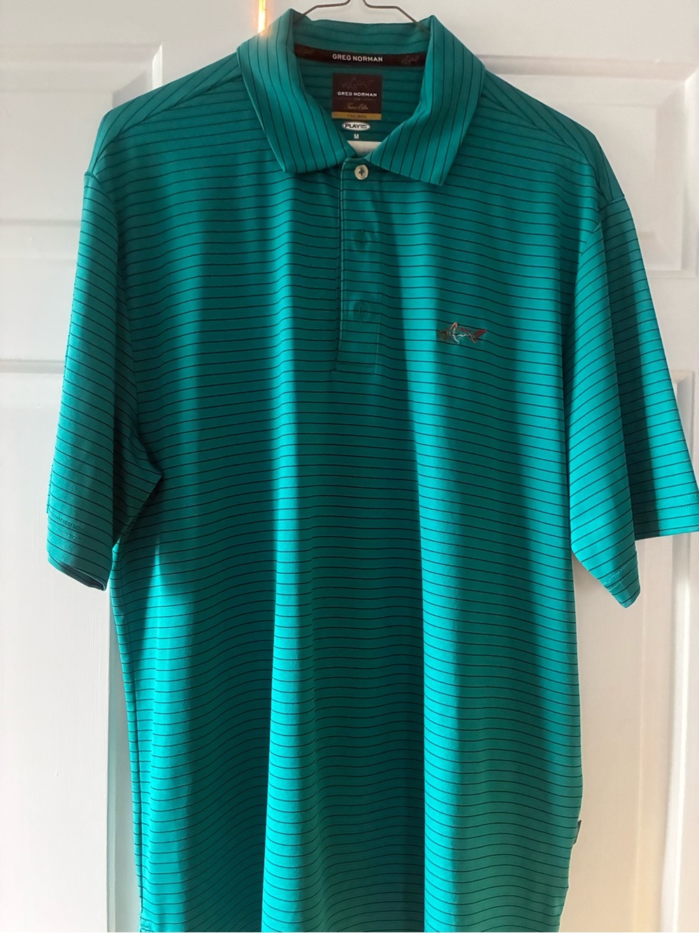 Greg Norman Collection Teal Polo with Thin Black Stripes